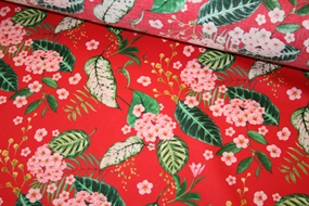 Bomuld med lyserøde blomster på rød bund