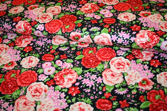 Bomuldsstof med farvestrålende blomsterprint