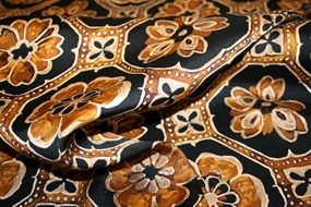 Deadstock uld -og silkeblanding med grafisk print i okker og sort