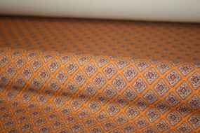 Blomstret orange silke -og uldblanding