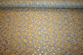 Silke chiffon med guldprikker og blå blomster på en gul bund