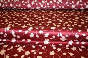 Silke stof med stiliserede blomster på en bordeaux bund