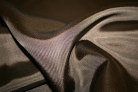 Mørkebrun vævet viskose ottoman