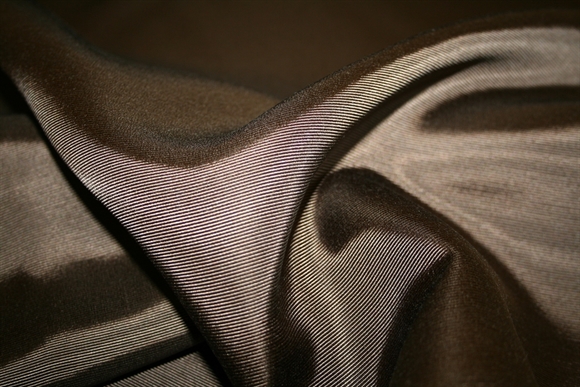 Mørkebrun vævet viskose ottoman