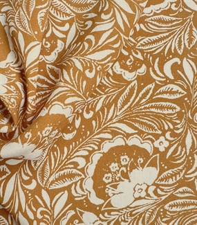 Vævet viskose stof med okkergult middelhavsprint